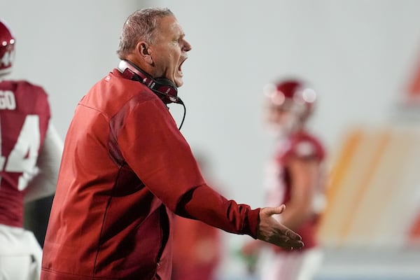 Arkansas head coach Sam Pittman yells to his players during the first half of the Liberty Bowl NCAA college football game against Texas Tech, Friday, Dec. 27, 2024, in Memphis, Tenn. (AP Photo/George Walker IV)