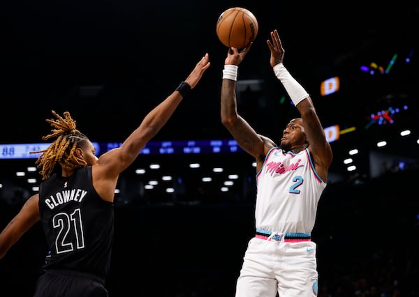 Miami Heat guard Terry Rozier (2) shoots over Brooklyn Nets forward Noah Clowney (21) during the second half of an NBA basketball game, Saturday, Jan. 25, 2025, in New York. (AP Photo/Noah K. Murray)