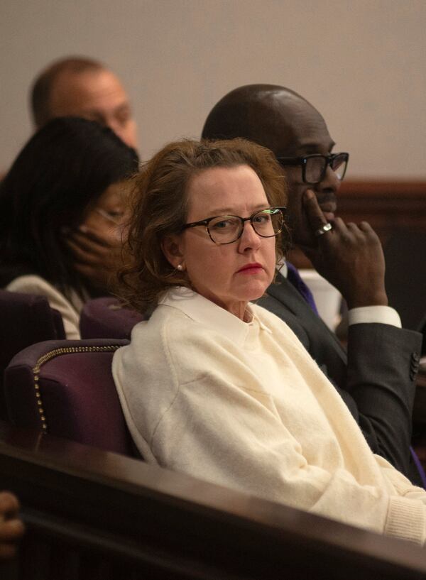 Former Brunswick Judicial Circuit Jackie Johnson sits with her defense team as court opens Thursday, Jan. 30, 2025, in Brunswick, Ga., where she is being tried on charges of violating her oath of office and obstruction of justice in the death of Ahmaud Arbery. (Terry Dickson/The Brunswick News via AP, Pool)