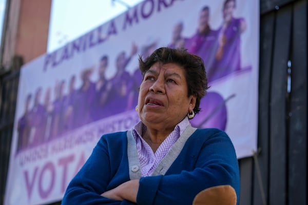 Blanca Delgadillo, a relative of one of five people who were killed the night before, speaks during an interview outside her home in Huitzilac, Mexico, Tuesday, Jan. 14, 2025. (AP Photo/Fernando Llano)