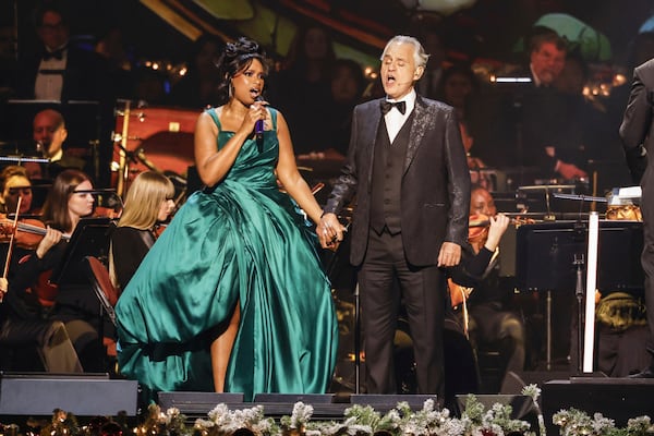 This image released by CBS, shows Jennifer Hudson, left, and Andrea Bocelli performing in the special "Andrea Bocelli and Friends: A Grammy Holiday Special." (Sonja Flemming/CBS via AP)