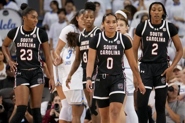 South Carolina players walk downcourt during the first half of an NCAA college basketball game against UCLA, Sunday, Nov. 24, 2024, in Los Angeles. (AP Photo/Eric Thayer)