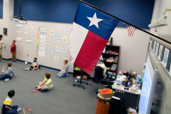 FILE - A Texas flag is displayed in an elementary school in Murphy, Texas, Thursday, Dec. 3, 2020. (AP Photo/LM Otero, File)