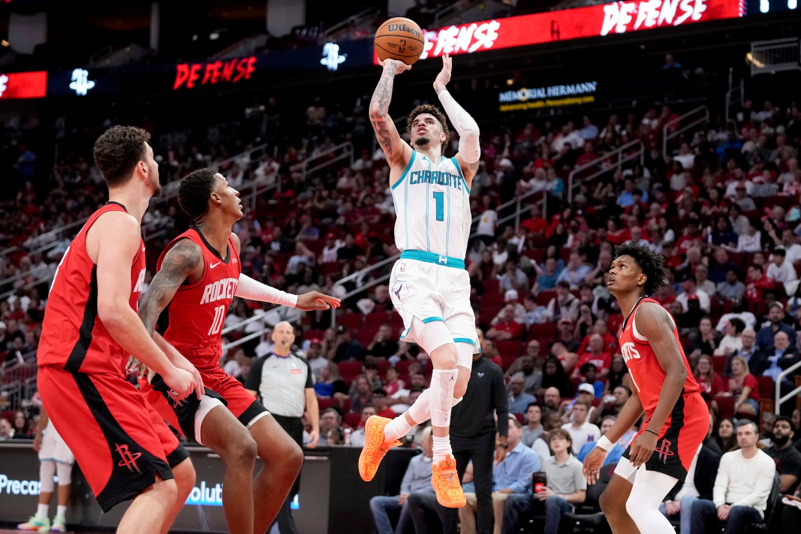 Charlotte Hornets guard LaMelo Ball (1) shoots against the Houston Rockets during the first half of an NBA basketball game Wednesday, Oct. 23, 2024, in Houston. (AP Photo/Eric Christian Smith)