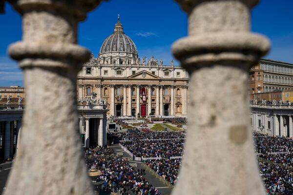 FILE - Faithful gather to attend the Catholic Easter Sunday mass led by Pope Francis in St. Peter's Square at the Vatican, April 17, 2022. (AP Photo/Alessandra Tarantino, File)