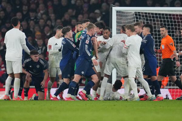 Arsenal's and Manchester United players argue during the English FA Cup soccer match between Arsenal and Manchester United at the Emirates stadium in London, Sunday, Jan. 12, 2025. (AP Photo/Kin Cheung)