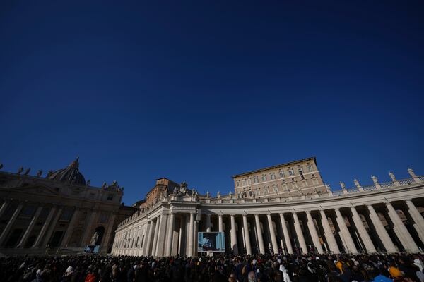 Pope Francis appears at his studio's window overlooking St. Peter's Square at The Vatican to bless pilgrims and faithful after presiding over a mass in St. Peter's Basilica on New Year's Day, Wednesday, Jan. 1, 2025. (AP Photo/Andrew Medichini)