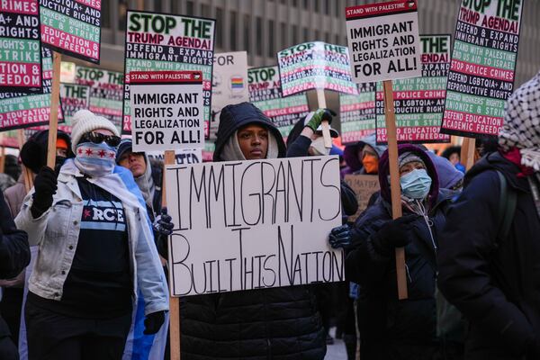 Sonia Rosa Sifore and other anti-Trump protesters gather in Federal Plaza to rally for a number of issues, including immigrant rights, the Israel-Hamas war, women's reproductive rights, racial equality and others, on the day of President Trump's Inauguration, Monday, Jan. 20, 2025, in Chicago. (AP Photo/Erin Hooley)