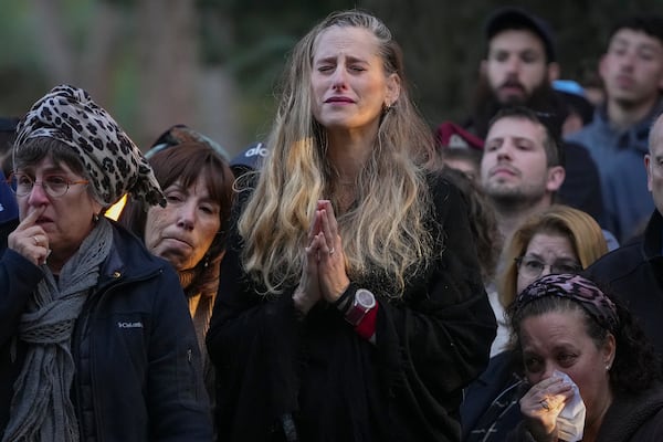 Relatives and friends of 1st Sgt. Hillel Diener, who was killed in combat in the Gaza Strip, mourn during his funeral at the Mount Herzl military cemetery in Jerusalem, Israel, Tuesday, Dec. 24, 2024. (AP Photo/Ohad Zwigenberg)