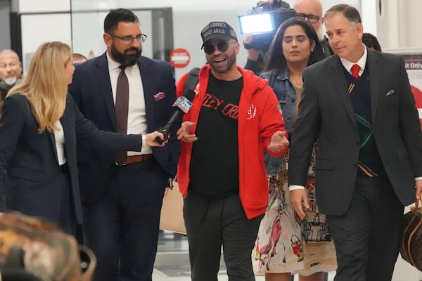 Recently pardoned by President Donald Trump after he was convicted of seditious conspiracy for his role in the January 6 attack on the U.S. Capitol, Enrique Tarrio answers questions after he arrived at Miami International Airport, Wednesday, Jan. 22, 2025, in Miami. (AP Photo/Marta Lavandier)