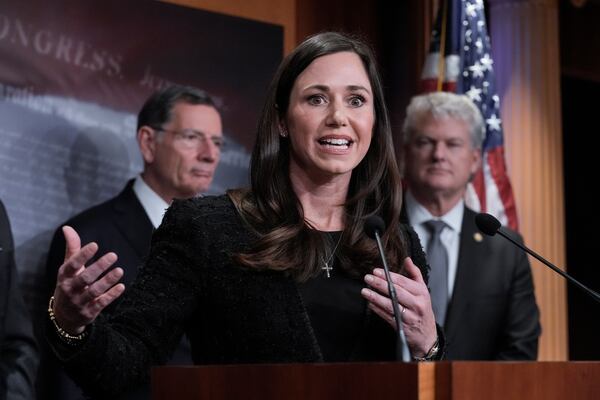 Sen. Katie Britt, R-Ala., center, is joined by Sen. John Barrasso, R-Wyo., the GOP whip, left, and Rep. Mike Collins, R-Ga., as they talk to reporters about the Laken Riley Act, a bill to detain unauthorized immigrants who have been accused of certain crimes, at the Capitol in Washington, Thursday, Jan. 9, 2025. Georgia nursing student Laken Riley was killed last year by a Venezuelan man who entered the U.S. illegally and was allowed to stay to pursue his immigration case. (AP Photo/J. Scott Applewhite)