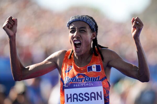 FILE - Sifan Hassan, of the Netherlands, celebrates after crossing the finish line to win the gold medal at the end of the women's marathon competition at the 2024 Summer Olympics, Sunday, Aug. 11, 2024, in Paris, France. (AP Photo/Vadim Ghirda, File)