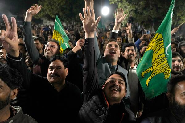 Supporters of Former Prime Minister Nawaz Sharif' party 'Pakistan Muslim League-N' celebrate their party victory in the initial results of the country's parliamentary election, in Lahore, Pakistan, Friday, Feb. 9, 2024. (AP Photo/K.M. Chaudary)