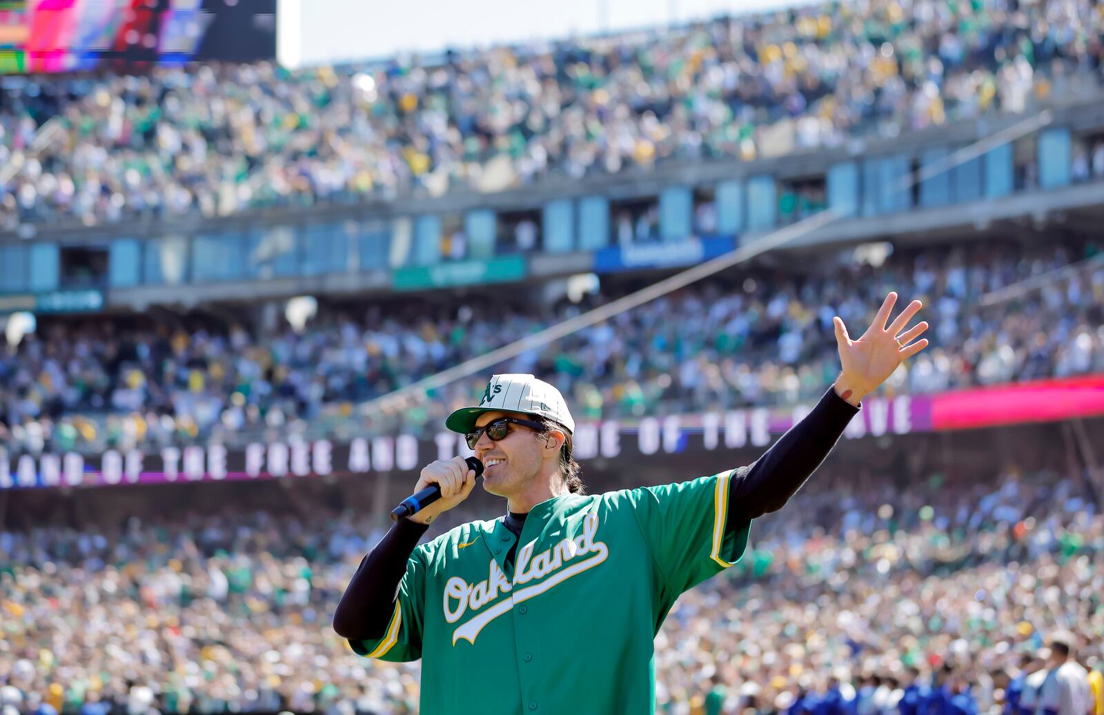 FILE - Former Oakland Athetics pitcher Barry Zito sings the national anthem before the Athletics play the Texas Rangers in Oakland, Calif., Sept. 26, 2024. (Carlos Avila Gonzalez/San Francisco Chronicle via AP, File)