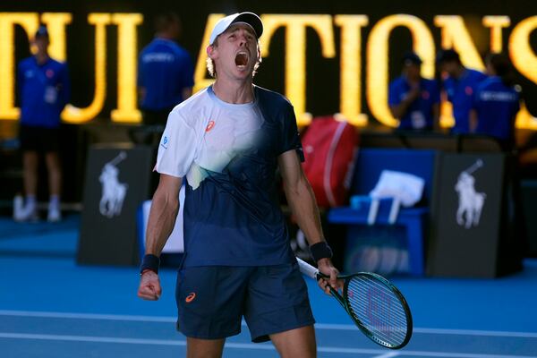 Alex de Minaur of Australia celebrates after defeating Francisco Cerundolo of Argentina in their third round match at the Australian Open tennis championship in Melbourne, Australia, Saturday, Jan. 18, 2025. (AP Photo/Asanka Brendon Ratnayake)