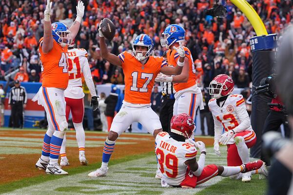 Denver Broncos wide receiver Devaughn Vele (17) celebrates after catching a touchdown pass during the first half of an NFL football game against the Kansas City Chiefs Sunday, Jan. 5, 2025, in Denver. (AP Photo/David Zalubowski)