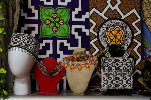 Crafts made by Sadith Silvano sit at her home and workshop in Lima, Peru, Saturday, Oct. 19, 2024. “Every design tells a story,” said Silvano, from Paoyhan, a Shipibo-Konibo Indigenous community in the Amazon. (AP Photo/Guadalupe Pardo)