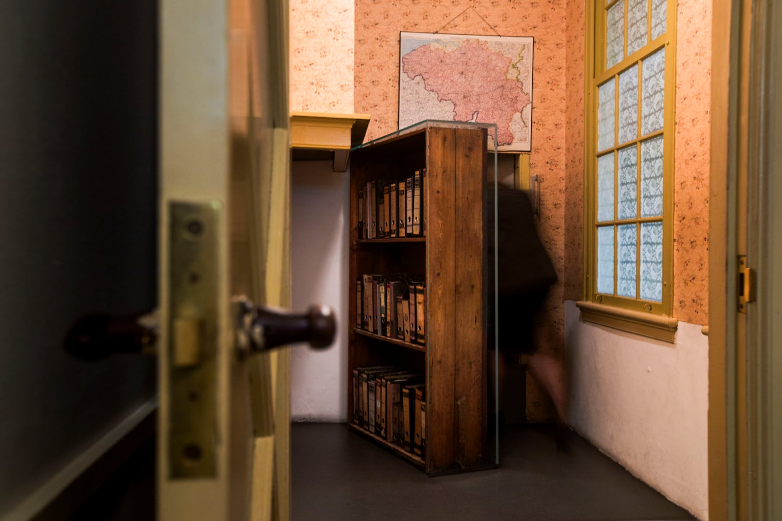 FILE - A woman enters the secret annex at the renovated Anne Frank House Museum in Amsterdam, Netherlands, Wednesday, Nov. 21, 2018. (AP Photo/Peter Dejong, File)