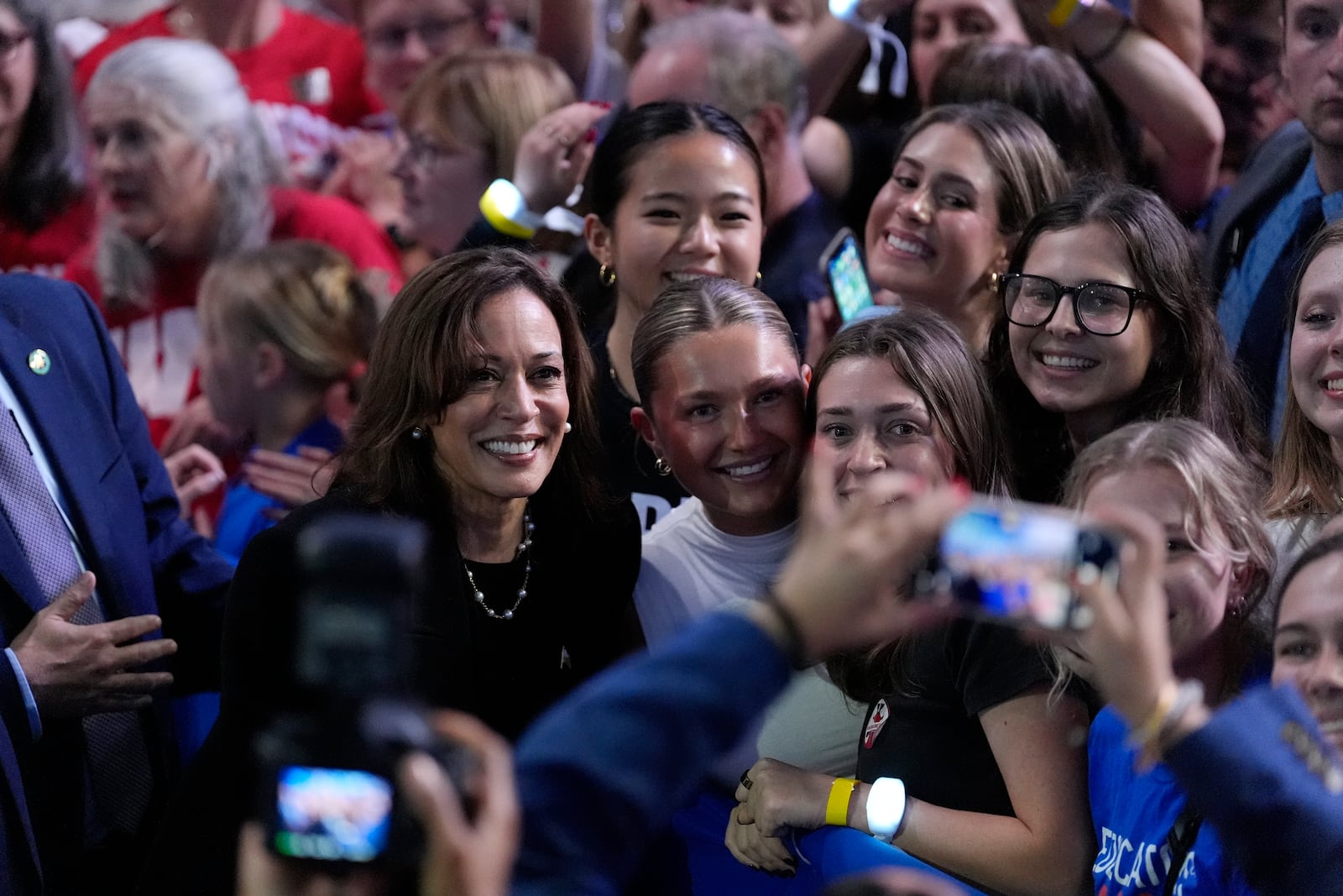 Democratic presidential nominee Vice President Kamala Harris takes a photo with supporters during a campaign rally at the Alliant Energy Center in Madison, Wis., Wednesday, Oct. 30, 2024. (AP Photo/Jacquelyn Martin)