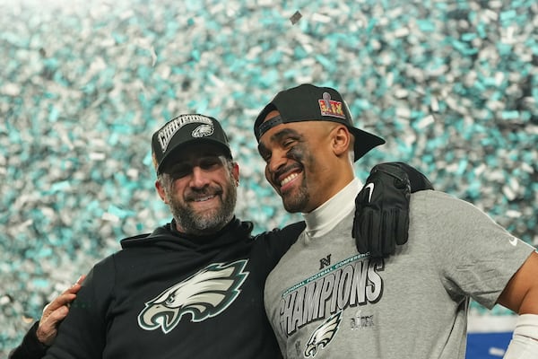 Philadelphia Eagles coach Nick Sirianni, left, quarterback Jalen Hurts celebrate after the Eagles won the NFC Championship NFL football game against the Washington Commanders, Sunday, Jan. 26, 2025, in Philadelphia. (AP Photo/Matt Slocum)