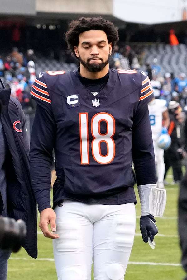 Chicago Bears quarterback Caleb Williams walks off the field after his team's 34-17 loss to the Detroit Lions in an NFL football game Sunday, Dec. 22, 2024, in Chicago. (AP Photo/Nam Y. Huh)