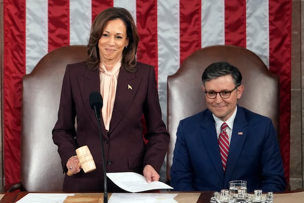 Vice President Kamala Harris reads the results as House Speaker Mike Johnson of La., listens during a joint session of Congress to confirm the Electoral College votes, affirming President-elect Donald Trump's victory in the presidential election, Monday, Jan. 6, 2025, at the U.S. Capitol in Washington. (AP Photo/Matt Rourke)