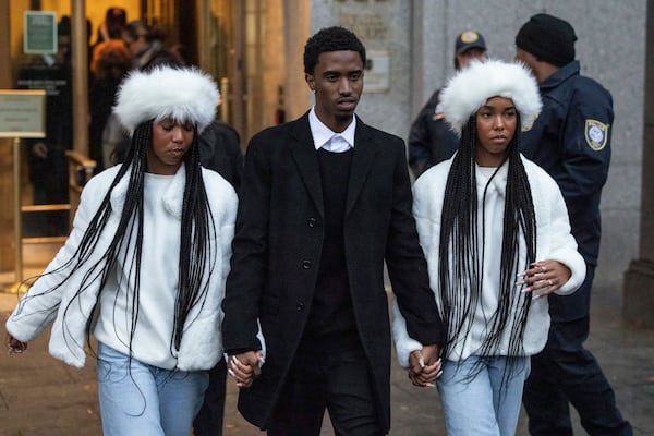 King Combs, center, son, D'Lila Combs and Jessie Combs, daughters of Sean "Diddy" Combs, leave Manhattan federal court, Friday, Nov. 22 2024, in New York. (AP Photo/Yuki Iwamura)