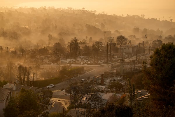 The devastation of the Palisades Fire is seen in the early morning in the Pacific Palisades neighborhood of Los Angeles, Friday, Jan. 10, 2025. (AP Photo/John Locher)