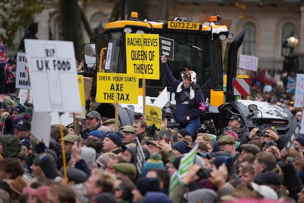 Farmers protest to urge the government to change course over its inheritance tax plans, in London, Tuesday, Nov. 19, 2024. (AP Photo/Kin Cheung)