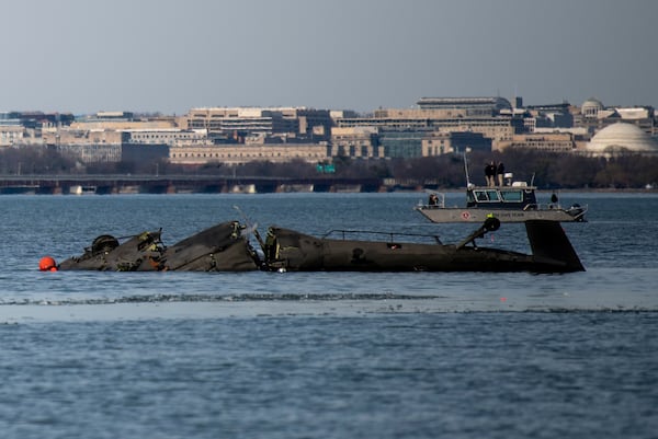 In this image provided by the U.S. Coast Guard, wreckage is seen in the Potomac River near Ronald Reagan Washington National Airport, Thursday, Jan. 30, 2025 in Washington. (Petty Officer 2nd Class Taylor Bacon, U.S. Coast Guard via AP)