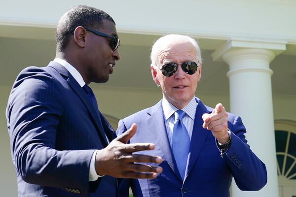 FILE - President Joe Biden speaks with Environmental Protection Agency administrator Michael Regan, left, in the Rose Garden of the White House in Washington, April 21, 2023. (AP Photo/Susan Walsh, File)