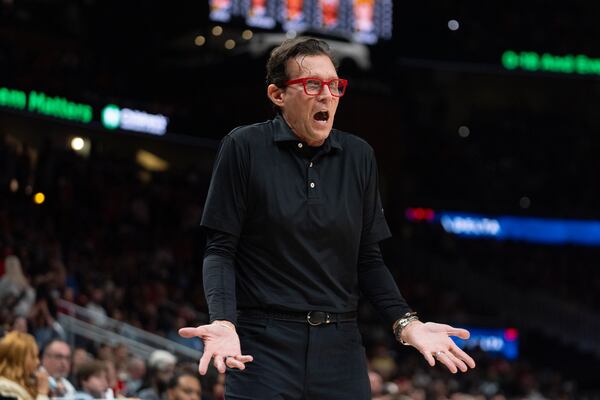 Atlanta Hawks head coach Quin Snyder reacts on the sideline during the first half of an NBA basketball game against the Denver Nuggets Sunday, Dec. 8, 2024 in Atlanta. (AP Photo/John Bazemore)