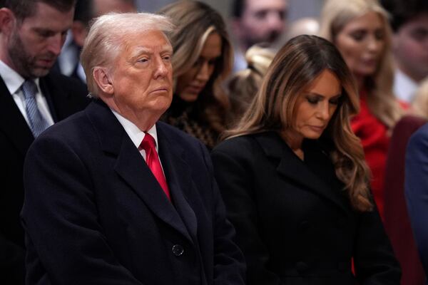 President Donald Trump, left, and first lady Melania Trump attend the national prayer service at the Washington National Cathedral, Tuesday, Jan. 21, 2025, in Washington. (AP Photo/Evan Vucci)