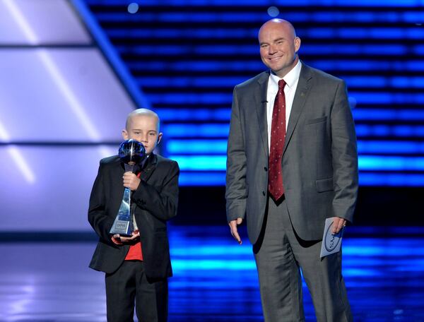 FILE - Jack Hoffman, left, accepts the award for best moment at the ESPY Awards, July 17, 2013, at Nokia Theater in Los Angeles. At right is Andy Hoffman. (Photo by John Shearer/Invision/AP, File)