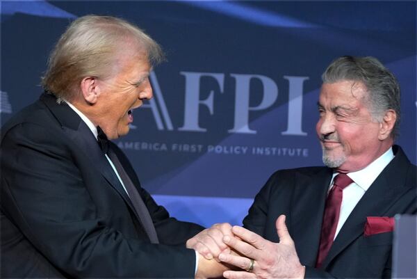 FILE - President-elect Donald Trump greets actor Sylvester Stallone during an America First Policy Institute gala at his Mar-a-Lago estate on Nov. 14, 2024, in Palm Beach, Fla. (AP Photo/Alex Brandon, File)