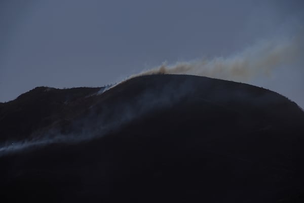 Smoke plumes rise from a hill Thursday, Jan. 23, 2025 in Camarillo, Calif., where the Laguna Fire fire broke out. (AP Photo/Brittany Peterson)