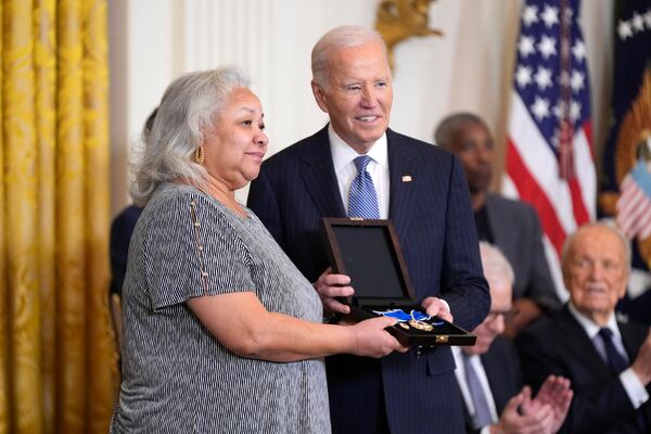 President Joe Biden, right, posthumously presents the Presidential Medal of Freedom, the Nation's highest civilian honor, to Doris Hamer Richardson on behalf of her late aunt Fannie Lou Hamer in the East Room of the White House, Saturday, Jan. 4, 2025, in Washington. (AP Photo/Manuel Balce Ceneta)