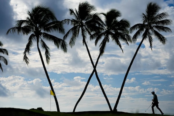 Taylor Pendrith, of Canada, walks across the 16th green during the first round of the Sony Open golf event, Thursday, Jan. 9, 2025, at Waialae Country Club in Honolulu. (AP Photo/Matt York)