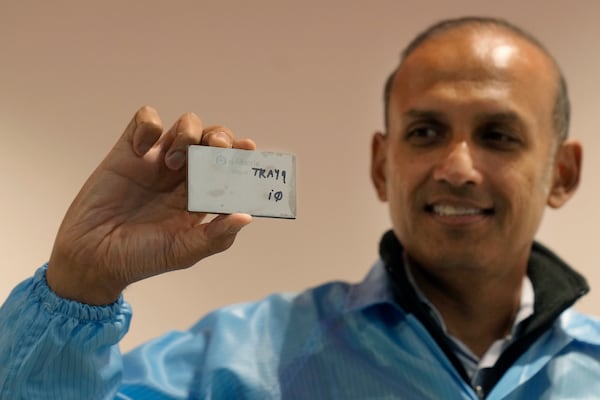 Sid Sheth, CEO and Co-founder of d-Matrix, holds up a d-Matrix Corsair chip during an interview in Santa Clara, Calif., Wednesday, Oct. 16, 2024. (AP Photo/Jeff Chiu)