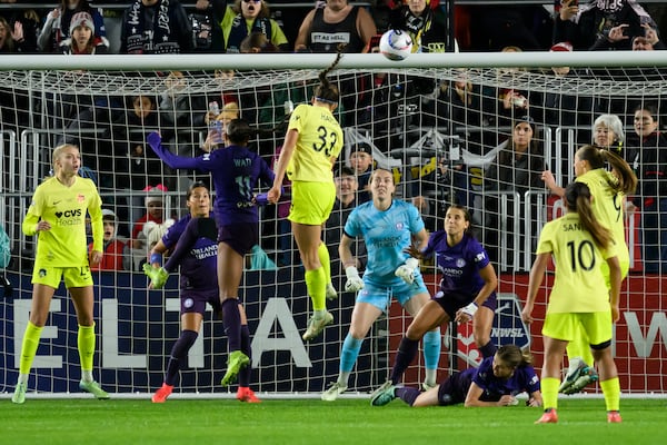 Washington Spirit forward Ashley Hatch (33) tries to head the ball into the goal during the second half of the NWSL championship against the Orlando Pride at CPKC Stadium, Saturday, November 23, 2024, in Kansas City, Mo. (AP Photo/Reed Hoffmann)