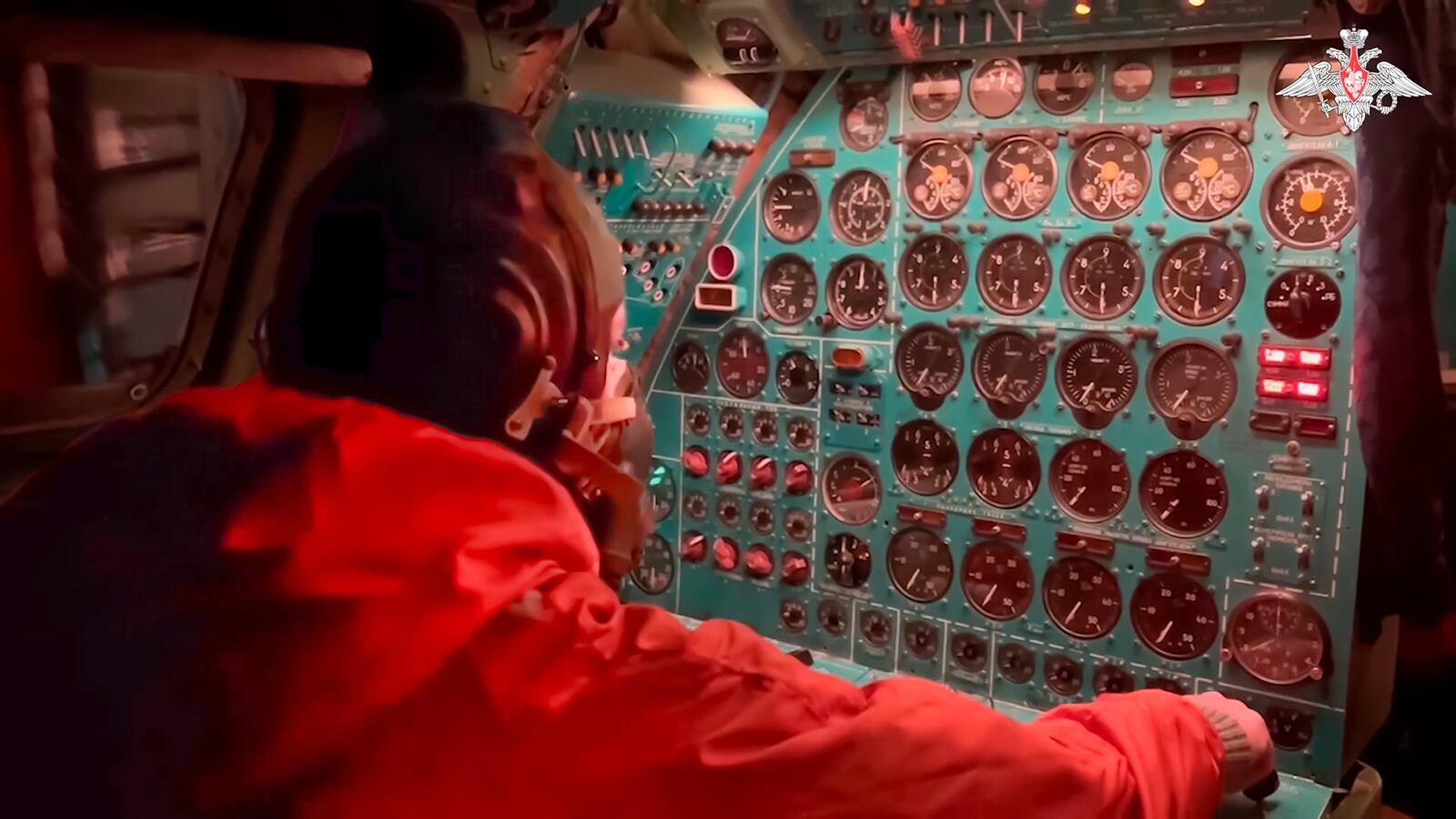 In this photo taken from video distributed by Russian Defense Ministry Press Service on Tuesday, Oct. 29, 2024, a Russian air force crew member oversees an instrument panel on board a Tu-95 nuclear-capable strategic bomber during drills of Russia's nuclear forces. (Russian Defense Ministry Press Service via AP)