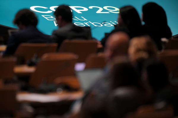 People listen to speeches during a plenary session at the COP29 U.N. Climate Summit, Tuesday, Nov. 19, 2024, in Baku, Azerbaijan. (AP Photo/Peter Dejong)