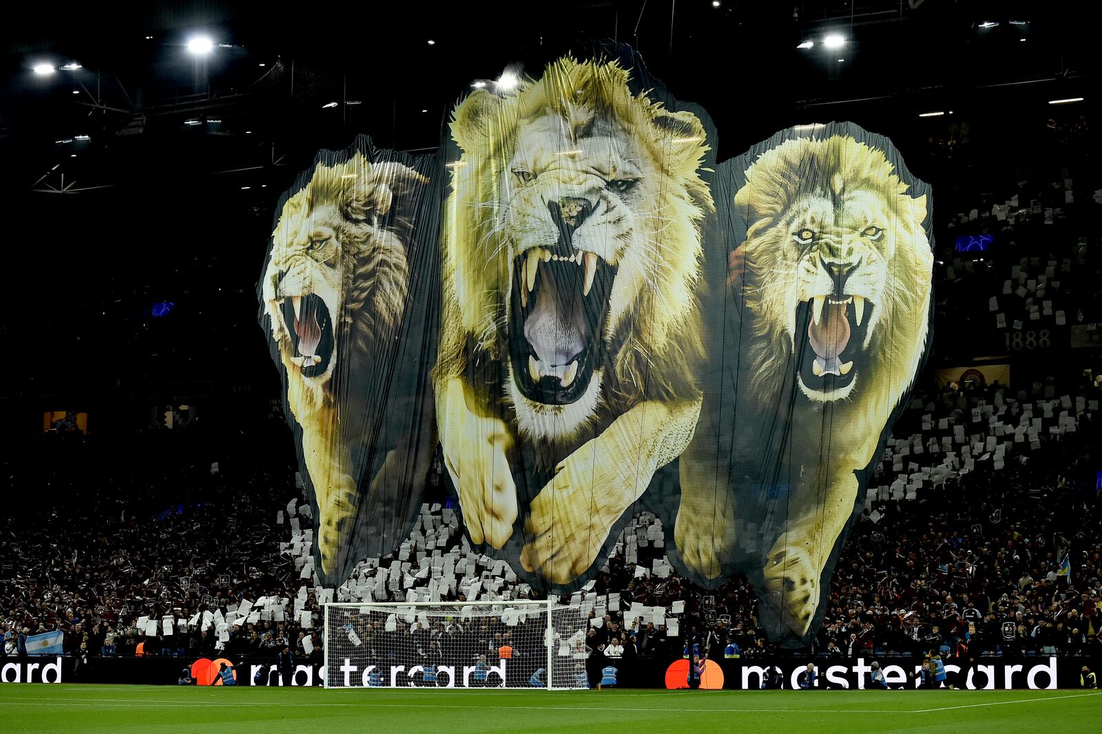 Fans unveil a giant banner prior to the Champions League opening phase soccer match between Aston Villa and Bologna at the Villa Park in Birmingham, England, Tuesday, Oct. 22, 2024. (AP Photo/Rui Vieira)