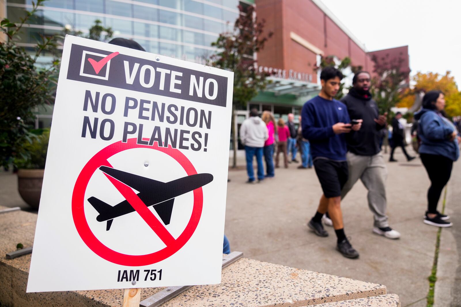 A picket sign sits outside the Angel of the Winds Arena as striking Boeing employees gather to cast their votes, Wednesday, Oct. 23, 2024, in Everett, Wash. (AP Photo/Lindsey Wasson)