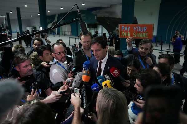 Wopke Hoekstra, EU climate commissioner, speaks to members of the media at the COP29 U.N. Climate Summit, Sunday, Nov. 24, 2024, in Baku, Azerbaijan. (AP Photo/Joshua A. Bickel)