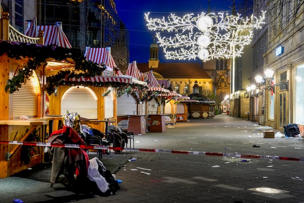 The Christmas market, where a car drove into a crowd on Friday evening, in Magdeburg, Germany, is empty on Saturday evening , Dec. 21, 2024. (AP Photo/Michael Probst)