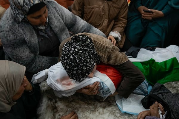 Tima Al-Khatib weeps over the body of her 2-year-old daughter Laila during her funeral in the West Bank village of Al-Shuhada, near Jenin, Sunday Jan. 26, 2025. According to the Palestinian health officials she was shot in the head by Israeli forces during an army operation in the area. Israel's military said it was reviewing the incident.(AP Photo/Majdi Mohammed)