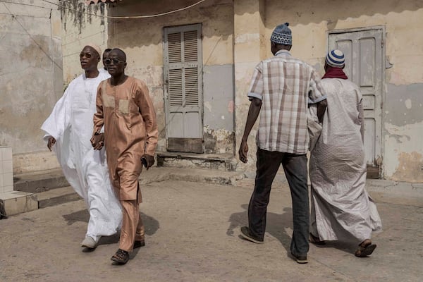 People arrive at a polling station to cast their ballot for legislative elections in Dakar, Senegal Sunday, Nov. 17, 2024. (AP Photo/Annika Hammerschlag)