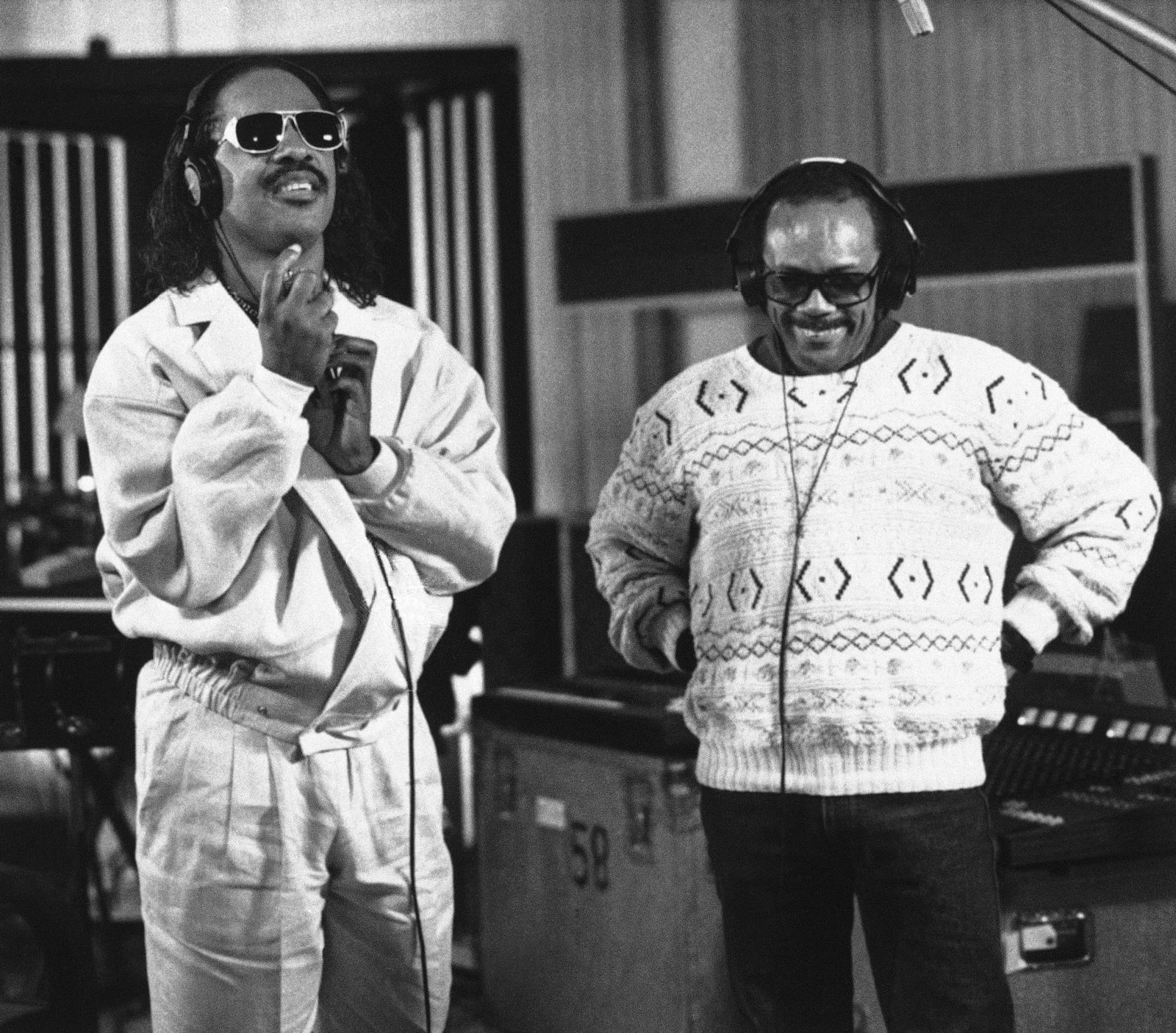 FILE - Recording star Stevie Wonder, left, and Quincy Jones participate in a coast-to-coast recording session, linked to a studio in New York, to record an anti-drug song, Wednesday, March 5, 1987 in Los Angeles. (AP Photo/Sunny Bak, File)