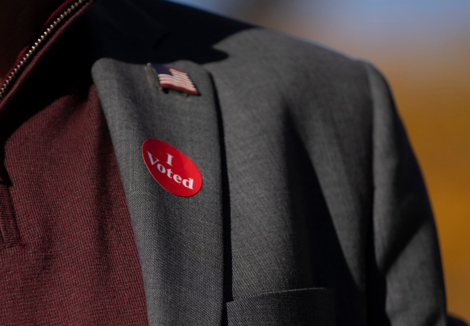 Minnesota Governor and Vice Presidential candidate Tim Walz wears an "I voted sticker" as he speaks to the press after early voting at Ramsey County Elections in St. Paul, Minn., on Wednesday, October 23, 2024. (Renée Jones Schneider/Star Tribune via AP)